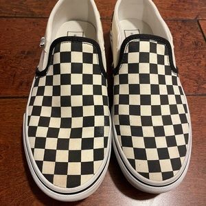 Vans women’s classic checkerboard white and black slip on shoes.